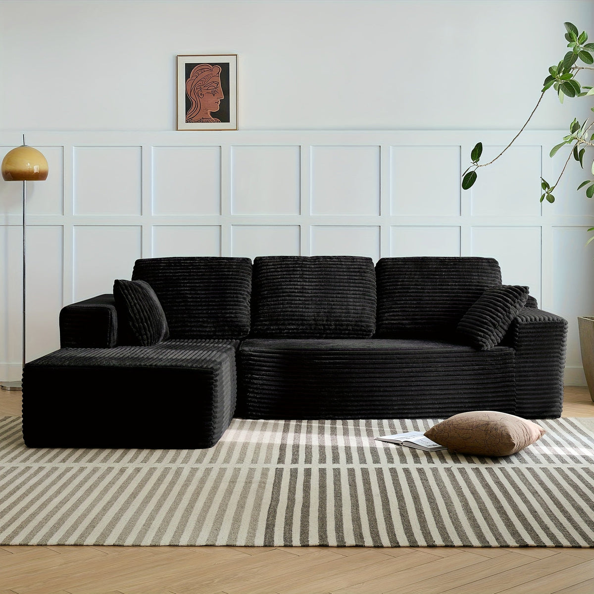 Oversized corduroy chaise sectional in black, L-shape with throw pillows
