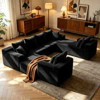 Black U-shaped cloud sofa with throw blanket