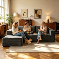 Family with dog on the dark gray L-shaped cloud sofa