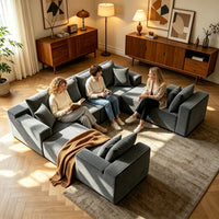 Three people reading on the U-shaped cloud sofa